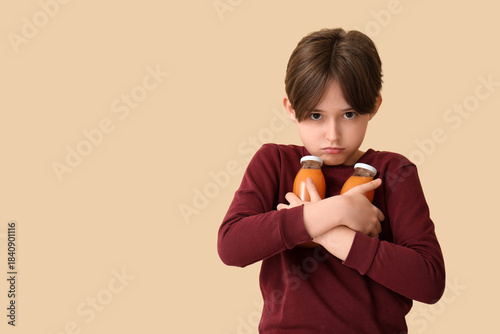 Little boy with bottles of ...