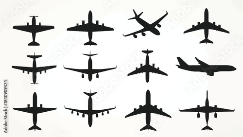 Silhouettes of various airplanes on a white background