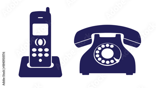 Vintage rotary phone and cordless phone on table 