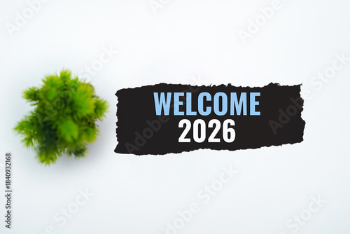 Welcome 2026 Message on Torn White Paper .New Year Celebration Concept