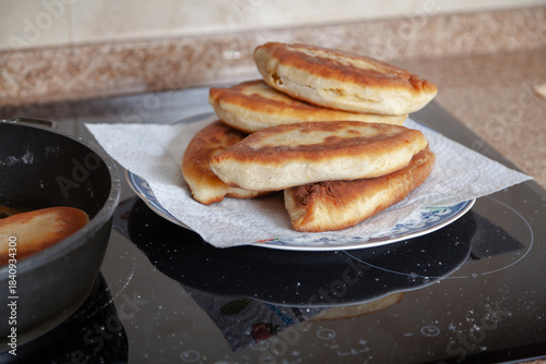 Appetizing fried pies lie on a plate
