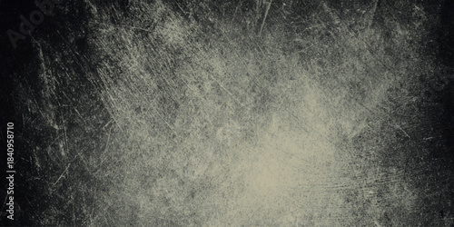 Monochromatic grunge is heavily distressed creating a moody dramatic vintage atmosphere.