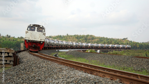 A fast-moving train glides smoothly along the railway tracks, showcasing power, motion, and precision in transportation