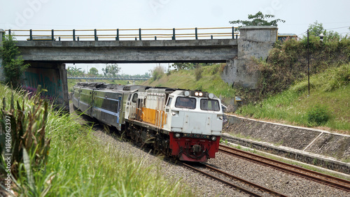 A fast-moving train glides smoothly along the railway tracks, showcasing power, motion, and precision in transportation