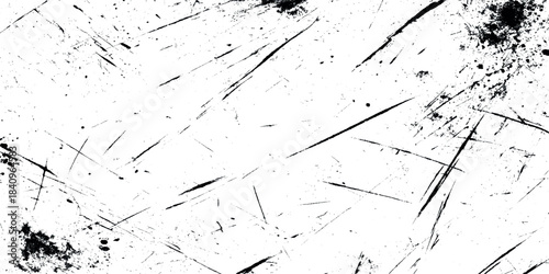 Abstract black and white grunge overlay texture featuring realistic scratches and white gritty grunge background.