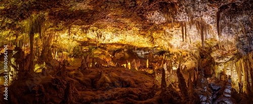 Explore the stunning caves of Mallorca, Spain. Witness the breathtaking stalactites and stalagmites in this underground paradise, perfect for tourists seeking adventure.