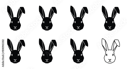 A collection of rabbit head silhouettes with one white bunny illustration