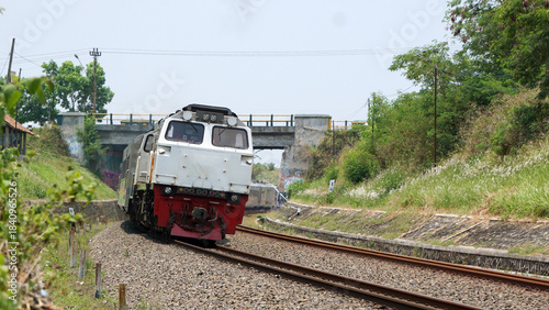 A fast-moving train glides smoothly along the railway tracks, showcasing power, motion, and precision in transportation