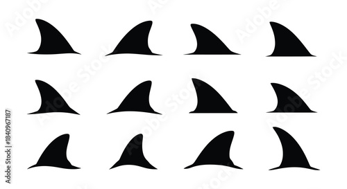 A collection of black shark fins arranged in a grid pattern on a white background