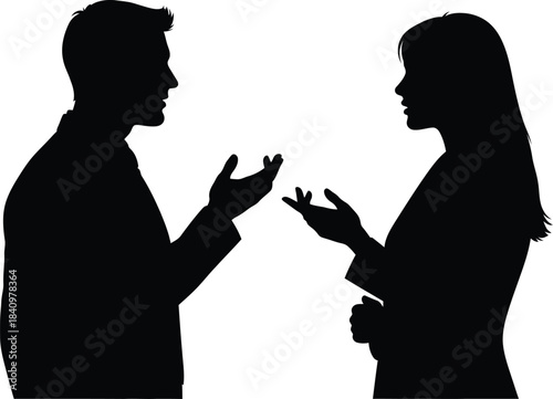Silhouette of two business people having a serious conversation with gestures