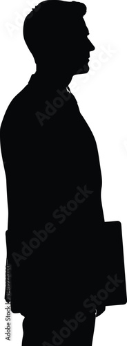 Silhouette of a businessman standing in profile holding a folder