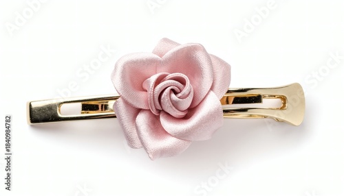 Delicate pale pink satin rose hair clip, elegantly crafted on a gleaming gold barrette for a touch of feminine charm and sophisticated style