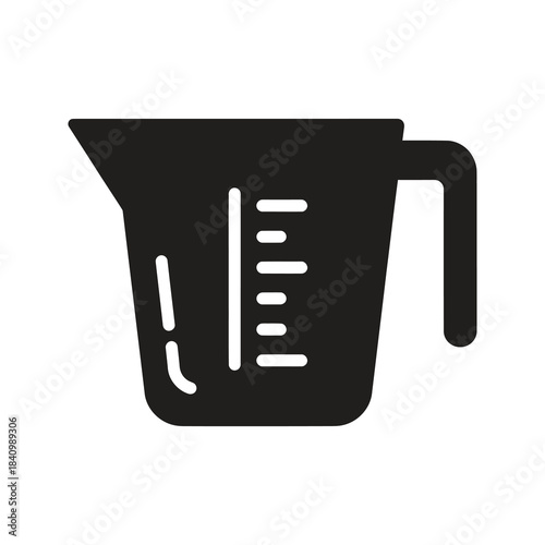 Measuring cup symbolizing liquid volume measurement and cooking ingredients