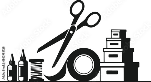 Large black scissors over office supplies and craft on a desk white craft desk