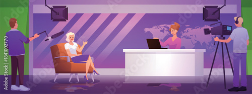 TV studio with a presenter at a table, a guest in a chair, and camera operators.