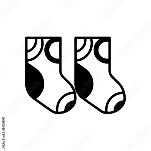 A tiny icon of two children’s socks, conveying softness, everyday comfort, and essentials in the wardrobe.