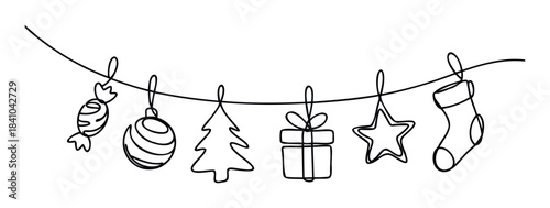 Christmas decorations including candy, ornament, tree, gift, star and stocking hanging on a string representing festive holiday celebrations and winter season joy for seasonal marketing and