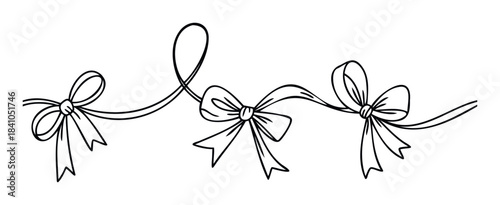 Elegant black ribbon with bows creating a decorative border, perfect for festive invitations, gift wrapping, or celebration embellishments.