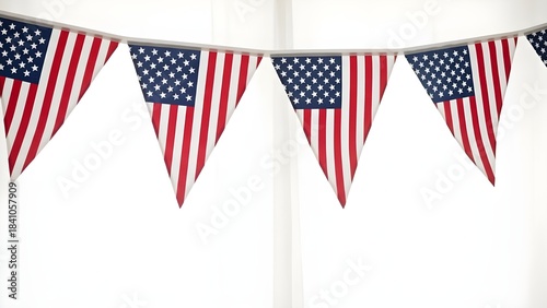 A string of american flag bunting flags hanging against a white background for patriotic celebrations