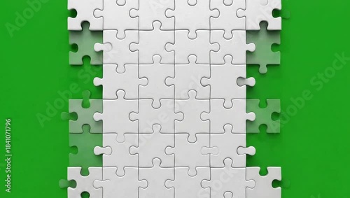 Green jigsaw puzzle piece representing a conceptual solution, success, and connection in a teamwork business abstract game