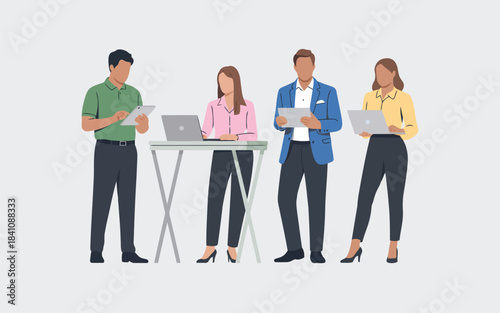 Four diverse business professionals standing and working with modern technology like laptops and tablets