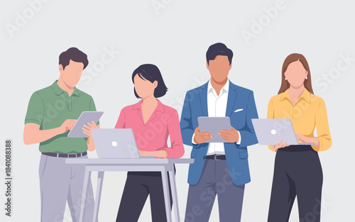 Four focused business colleagues working together on digital devices in a modern office environment