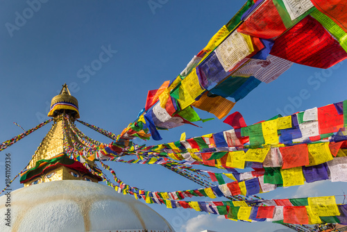 Prayer flags going up to the Boudhanath stupa in Kathmandu, Nepal