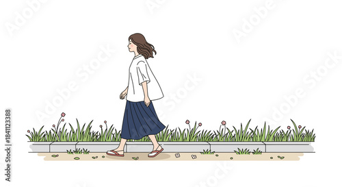 Woman walking alone on a path surrounded by flowers.