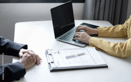 Business people hold a resume and talk to job applicants for job interviews about careers and Their personal history in the company. Recruitment concepts