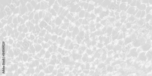 Foto Bright sun glare on rippling, clear water over  light gray tiled surface, creati