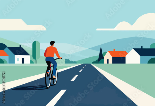 A person on a bike rides down a road, with houses lining the sides and clouds above. Mountains are in background