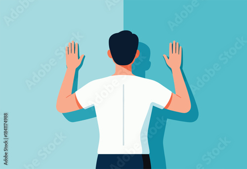 A person with dark hair, viewed from the back, arms outstretched against a dual-tone wall