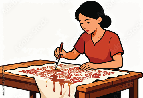 A woman crafts a floral pattern on fabric with a brush, creating drips of liquid dye on a wooden table