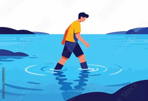 A person in a yellow shirt and shorts wading through water, with mountains in the distance
