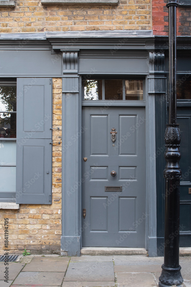 Fototapeta premium Traditional grey front door of historic london townhouse
