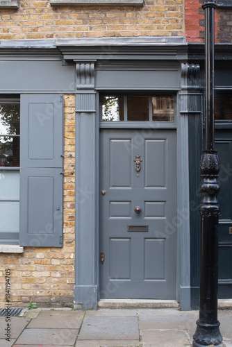 Traditional grey front door of historic london townhouse