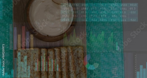 Animated data overlays sliding in on play over wooden board, bowl and crackers, showing menu trends