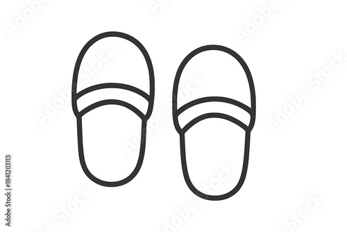 Slippers placed side by side on a plain background showing the simple design and outline of the footwear for indoor use
