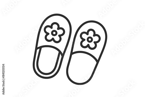 Slippers with flower design placed on a simple background
