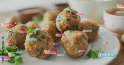 Camera shifting focus, drifting tags across while focus widening revealing fritters showing plating