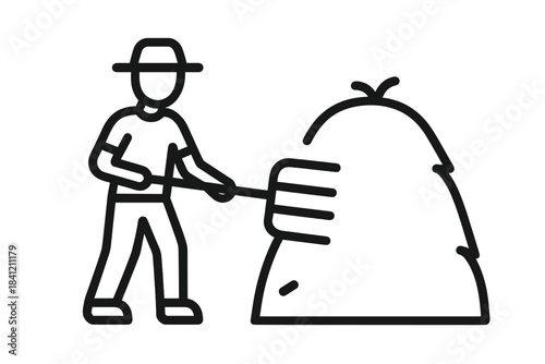 Farmer working with a pitchfork next to a haystack during the day in a rural field