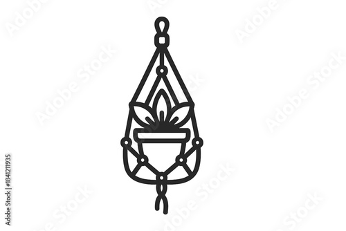 Minimalist small potted houseplant hanging in a decorative macrame holder