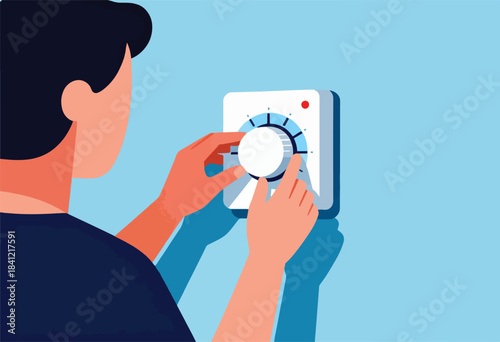 A person adjusts a white, square thermostat with a dial against a light blue wall, hands orange