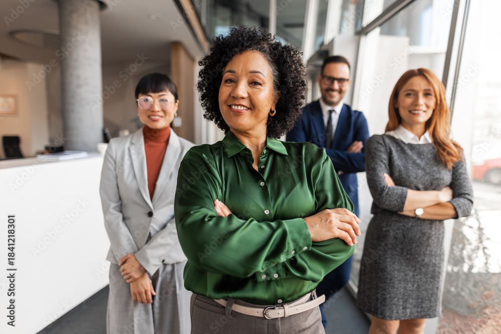 Obraz premium Confident Business Team Posing in Modern Office Environment