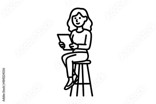 Woman sitting on high stool holding tablet device and looking at screen