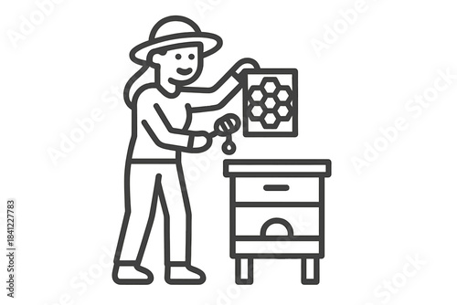 Beekeeper harvesting honey from a beehive frame using a honey dipper tool