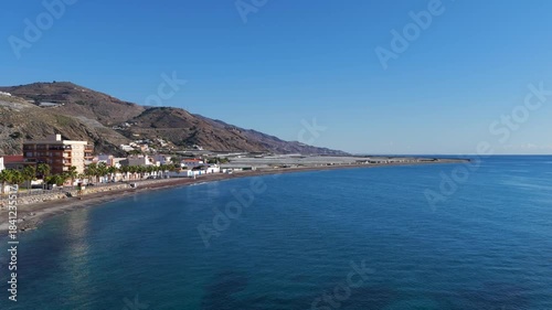 Wallpaper Mural Aerial View of Greenhouses on the Edge of the Arid Andalusian Desert Coast, Framed by the Mediterranean Sea and the White-Capped Sierra Nevada Mountains Torontodigital.ca