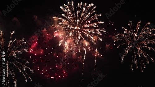Amazing real beautiful colorful fireworks background on celebration night event for happy new year party, Abstract Multi color golden firework in the night sky