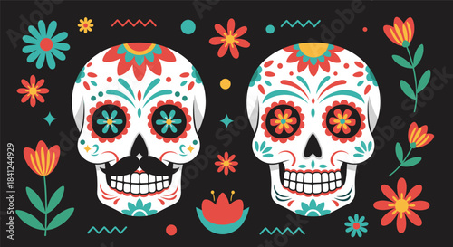Two colorful decorated sugar skulls with flowers on a black background for the Mexican Day of the Dead, Dia de los Muertos.