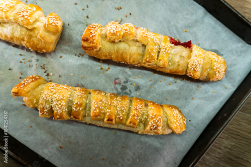 Puff pastry with strawberry jam. Jam-filled pastries. Food concept.